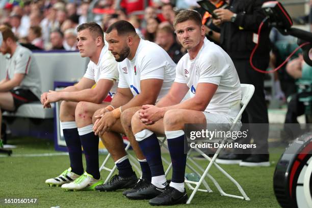 Freddie Steward, Ellis Genge and Owen Farrell of England look on as they sit in the Sin Bin after receiving yellow cards during the Summer...