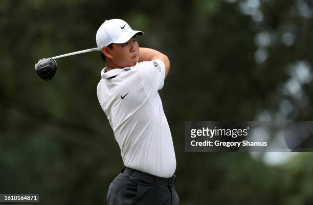 Tom Kim of South Korea plays his shot from the seventh tee during the third round of the FedEx St. Jude Championship at TPC Southwind on August 12,...
