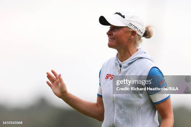 Charley Hull of England smiles on the 18th green on Day Three of the AIG Women's Open at Walton Heath Golf Club on August 12, 2023 in Tadworth,...