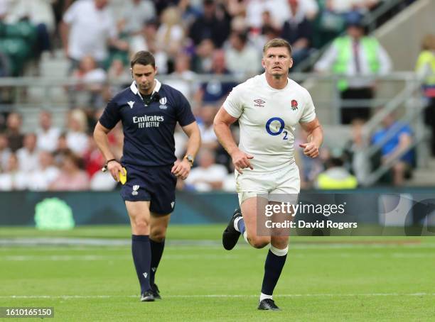 Owen Farrell of England reacts after receiving a yellow card from Referee Nika Amashukeli after a high tackle on Taine Basham of Wales during the...