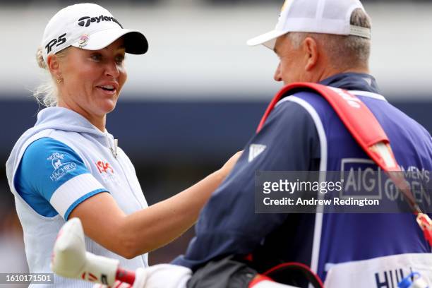 Charley Hull of England fist bump her caddie after fininshing her round on the 18th hole on Day Three of the AIG Women's Open at Walton Heath Golf...