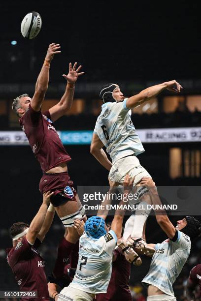 Racing92's French flanker Wenceslas Lauret is lifted in a line out next to Bordeaux-Begles' Australian lock Kane Douglas during the French Top14...