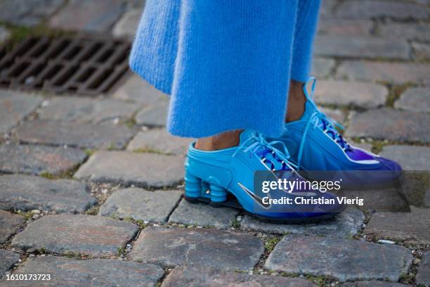 Cheyenne Maya Carty wears blue cashmere dress, Nike sneaker outside Ganni during the Copenhagen Fashion Week Spring/Summer 2024 on August 10, 2023 in...
