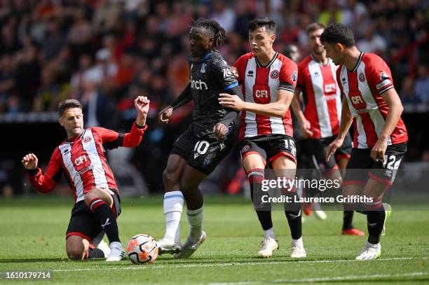 Eberechi Eze of Crystal Palace battles for possession with Oliver Norwood, Anel Ahmedhodzic and John Egan of Sheffield United during the Premier...