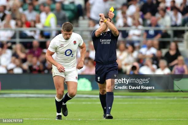 Owen Farrell of England reacts after receiving a yellow card from Referee Nika Amashukeli after a high tackle on Taine Basham of Wales during the...