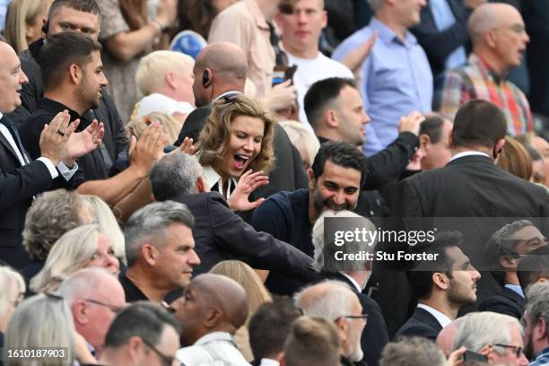 Newcastle United Co-Owners Amanda Staveley and Mehrdad Ghodoussi celebrate in the stands after the team's victory in the Premier League match between...