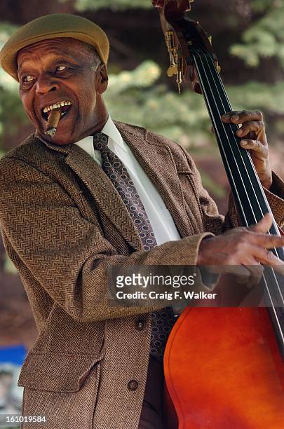 Charles Burrell of the Denver Municipal Band Jazz Trio plays his bass for the crowd gather for the dedication of Madam C.J. Walker Park. A'Lelia...