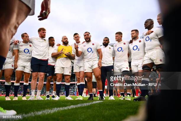 Ellis Genge of England speaks with teammates after making his 50th Cap Appearance after defeating Wales during the Summer International match between...