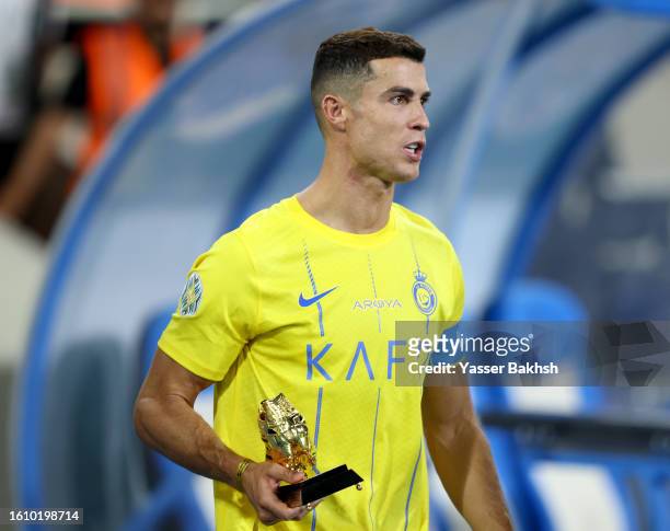 Cristiano Ronaldo of Al Nassr is awarded the Golden Boot after the team's victory in the Arab Club Champions Cup Final between Al Hilal and Al Nassr...
