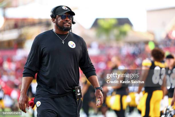 Head coach Mike Tomlin of the Pittsburgh Steelers smiles on the sidelines prior to an NFL preseason football game against the Tampa Bay Buccaneers at...