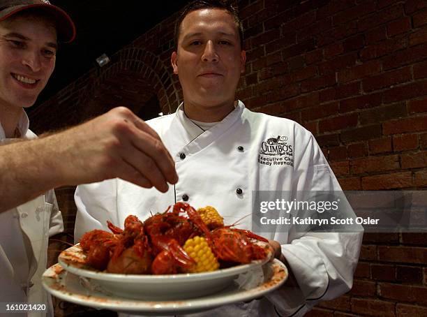 Executive chef Randy<cq> Reynolds, right,<cq> and assistant Mika<cq> Wenger<cq> from Gumbo's Louisiana Style Cafe<cq> in Denver, hopes 500 lbs. Of...