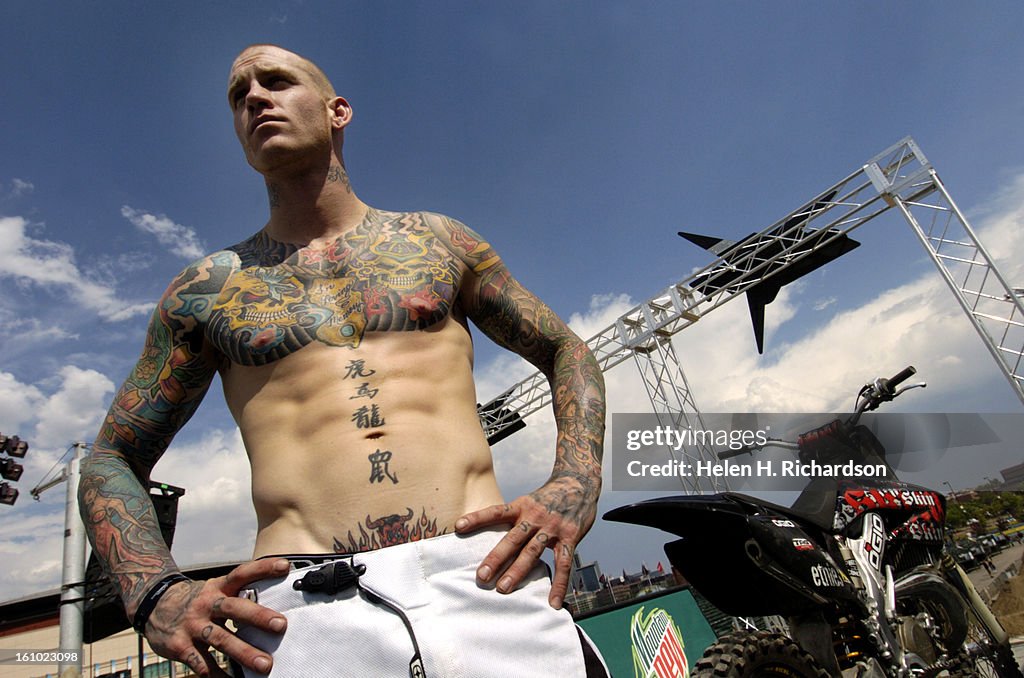07_08_05_DENVER,CO- Ronnie Faisst's tattoos cover his torso and back. He competes in FMX, freestyle motocross. PHOTOS BY HELEN H. RICHARDSON FASHIONS AT THE DEW ACTION SPORTS TOUR