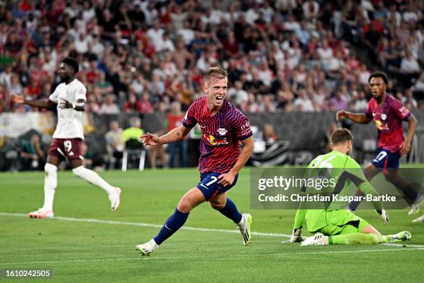 Dani Olmo of RB Leipzig celebrates after scoring the team's second goal during the DFL Supercup 2023 match between FC Bayern München and RB Leipzig...