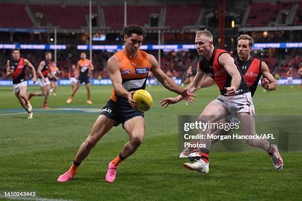 Toby Bedford of the Giants kicks the ball during the 2023 AFL Round 23 match between the GWS GIANTS and the Essendon Bombers at GIANTS Stadium on...