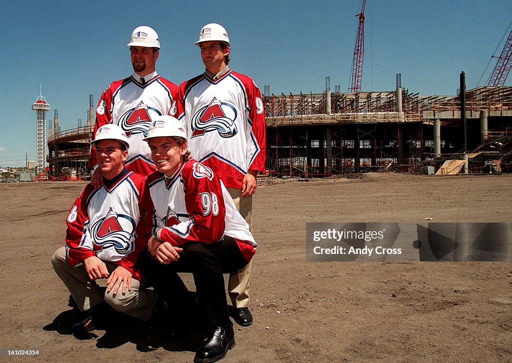 Newly acquired Av's players, (top left to right) Scott Parker, Robyn Regehr, (bottom left to right) Alex Tanguay and Martin Skoula pose for photographers in front of the Pepsi Center after a press conference.