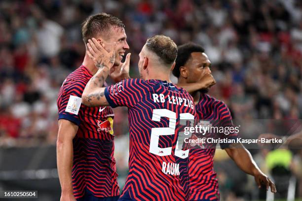 Dani Olmo of RB Leipzig celebrates with teammate David Raum after scoring the team's second goal during the DFL Supercup 2023 match between FC Bayern...