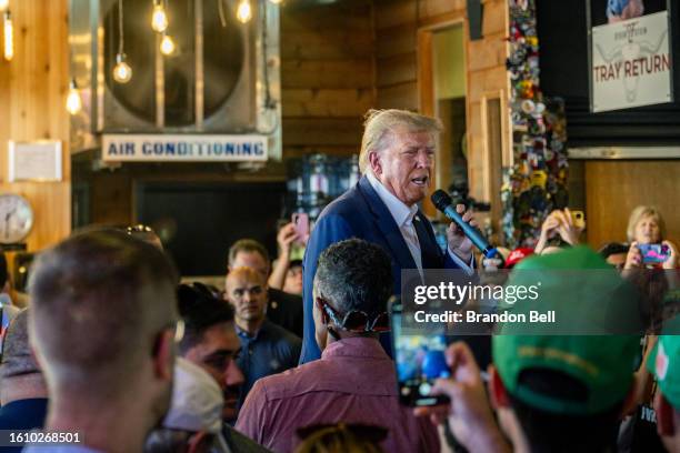 Former U.S. President Donald Trump speaks during a rally at the Steer N' Stein bar at the Iowa State Fair on August 12, 2023 in Des Moines, Iowa....