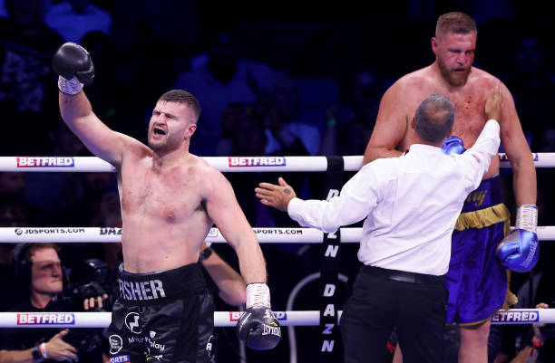 Johnny Fisher celebrates victory after the Referee calls the Fight after counting out Harry Armstrong during the BBBofC Southern Area Heavyweight...