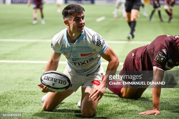 Racing92's French scrum-half Nolann Le Garrec reacts after he scored a try during the French Top14 rugby union match between Racing 92 and Union...