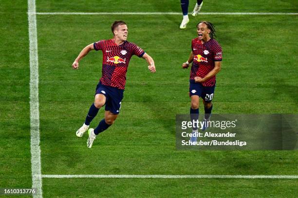 Dani Olmo of Leipzig celebrates his side's third goal with team mates Xavi Simons during the DFL Supercup 2023 match between FC Bayern München and RB...