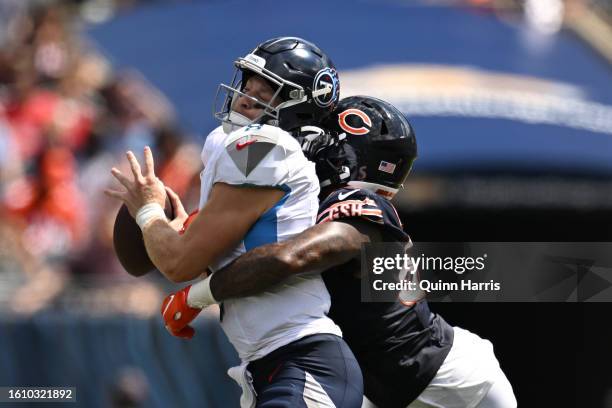 Will Levis of the Tennessee Titans is sacked in the second half by Terrell Lewis of the Chicago Bears during a preseason game at Soldier Field on...