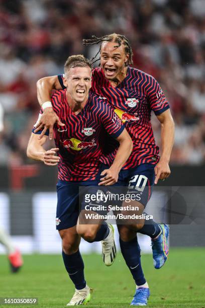 Dani Olmo of Leipzig celebrates his side's third goal with team mate Xavi Simons (R during the DFL Supercup 2023 match between FC Bayern München and...