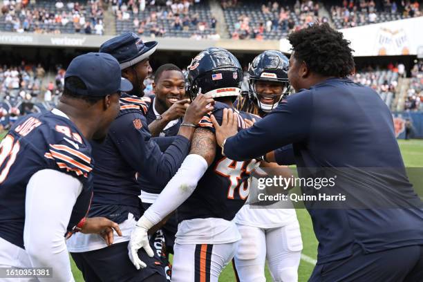 Eddie Jackson and Bralen Trahan of the Chicago Bears celebrate after the interception in the second half against the Tennessee Titans during a...