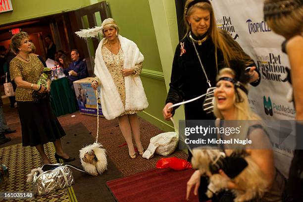 Participants in the New York Pet Fashion Show gather on the red carpet at Hotel Pennsylvania ahead of next week's Westminster Kennel Club Dog Show on...