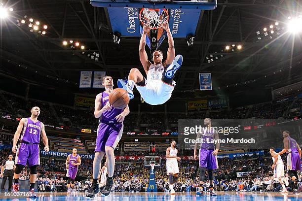 Daniel Orton of the Oklahoma City Thunder dunks against Luke Zeller the Phoenix Suns on February 8, 2013 at the Chesapeake Energy Arena in Oklahoma...