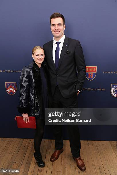 Dana Flacco and Joe Flacco pose backstage at the Tommy Hilfiger Fall 2013 Men's Collection fashion show during Mercedes-Benz Fashion Week at the Park...
