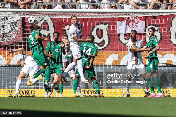 Ko Itakura of Borussia Moenchengladbach scores his team's first goal during the Bundesliga match between FC Augsburg and Borussia Mönchengladbach at...