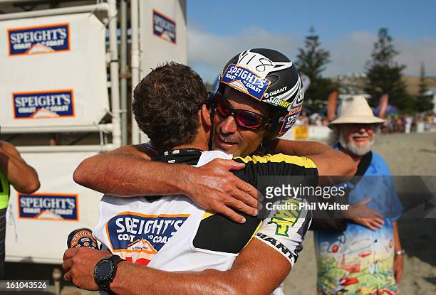 Braden Currie of New Zealand is hugged by Richard Ussher of New Zealand after winning the one day individual event during the 2013 Speights Coast to...