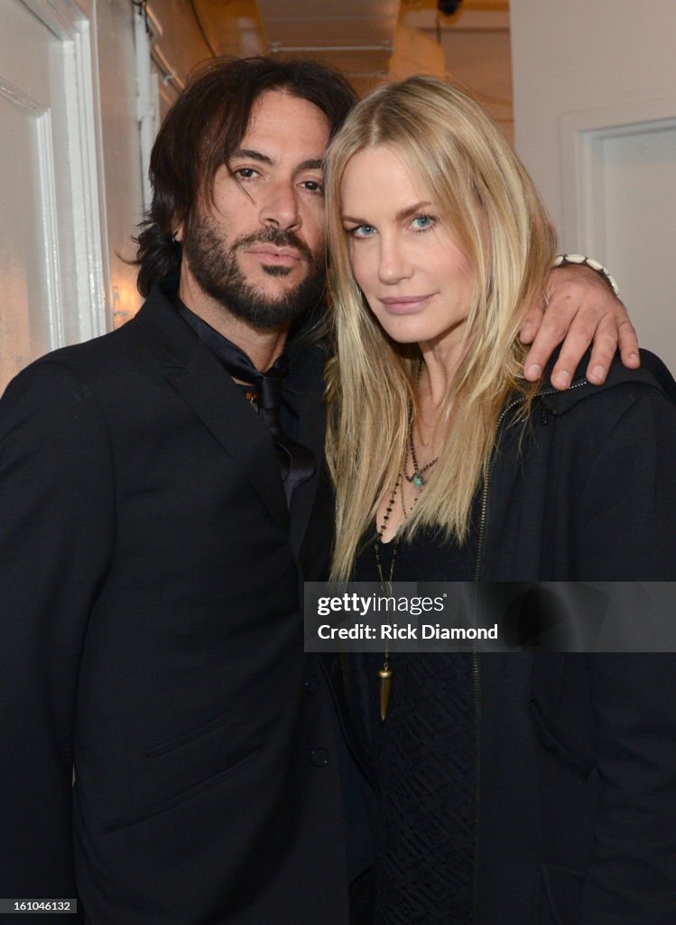 Rami Jaffee and actress Daryl Hannah pose backstage at the GRAMMYs