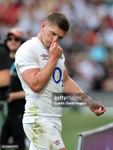 Owen Farrell, the England captain, walks off the pitch after receiving a yellow card which was later upgraded to red during the Summer International...