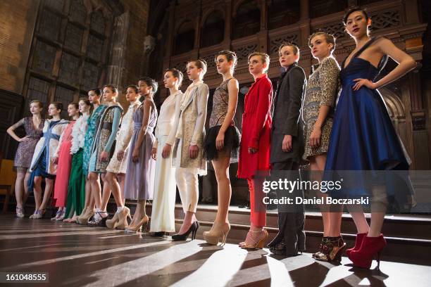 Models pose during the Yuna Yang fall 2013 presentation during Mercedes-Benz Fashion Week at the Desmond Tutu Center on February 8, 2013 in New York...