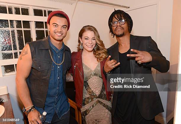 Recording artist Guy Sebastian, singer LeAnn Rimes and rapper Lupe Fiasco pose backstage at the GRAMMYs Dial Global Radio Remotes during The 55th...