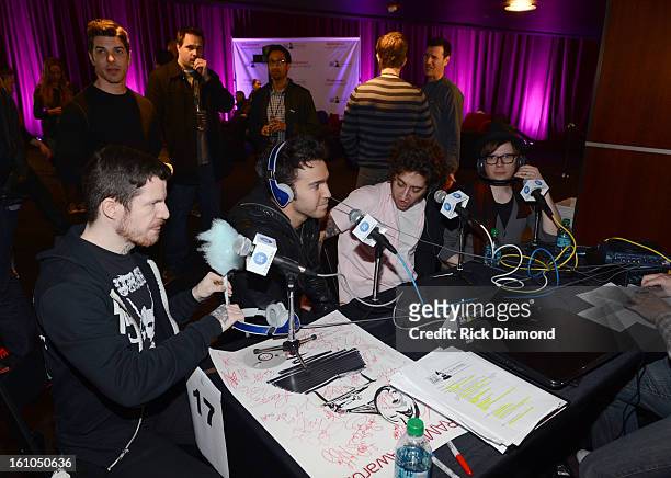 Musicians Andy Hurley, Pete Wentz, Joe Trohman, and Patrick Stump of Fall Out Boy are interviewed at the GRAMMYs Dial Global Radio Remotes during The...