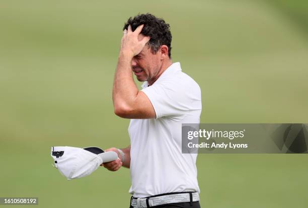 Rory McIlroy of Northern Ireland reacts to his putt on the 18th green during the third round of the FedEx St. Jude Championship at TPC Southwind on...