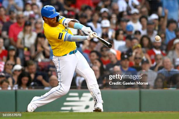 Justin Turner of the Boston Red Sox hits the ball in the fourth inning against the \d at Fenway Park on August 12, 2023 in Boston, Massachusetts.
