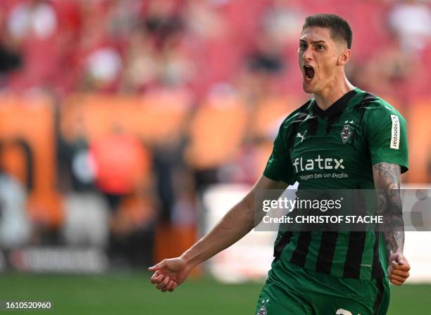 Moenchengladbach's Czech forward Tomas Cvancara celebrates scoring a penalty during German first division Bundesliga football match between FC...