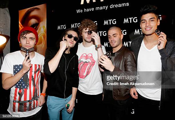 Singers Nathan Sykes, Tom Parker, Jay McGuiness, Max George, and Siva Kaneswaran of The Wanted pose backstage at the GRAMMYs Dial Global Radio...
