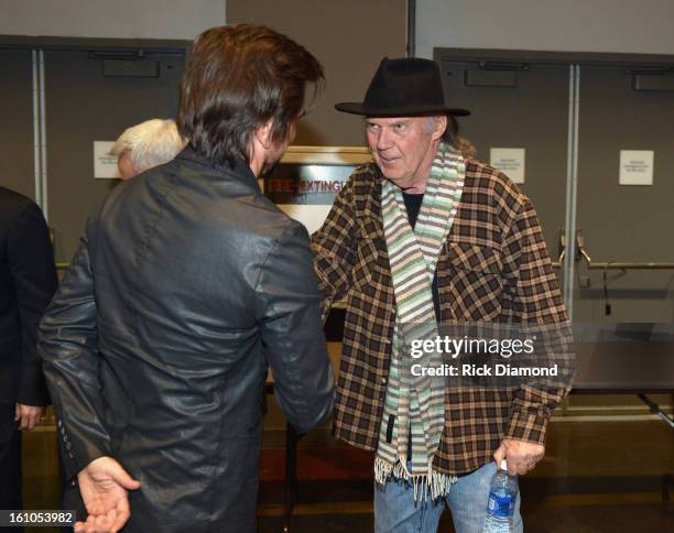 Musicians Neil Young and Juanes attend MusiCares Person Of The Year Honoring Bruce Springsteen at the Los Angeles Convention Center on February 8,...