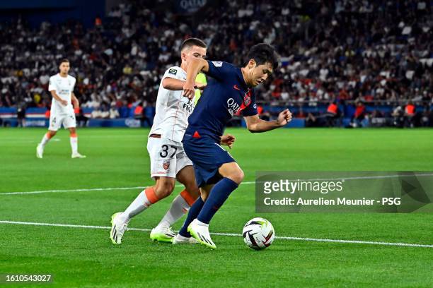Kang In Lee of Paris Saint-Germain fights for possession during the Ligue 1 Uber Eats match between Paris Saint-Germain and FC Lorient at Parc des...