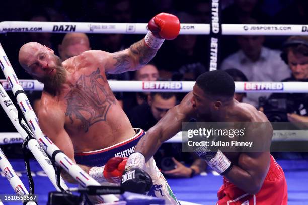 Anthony Joshua knocks down Robert Helenius during the Heavyweight fight between Anthony Joshua and Robert Helenius at The O2 Arena on August 12, 2023...