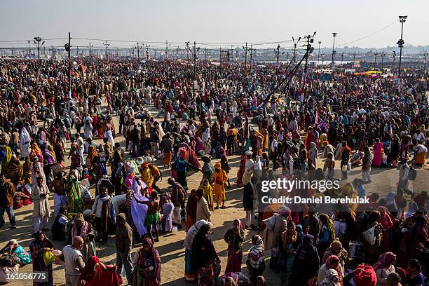 Hindu devotees gather to bathe on the banks of Sangam, the confluence of the holy rivers Ganges, Yamuna and the mythical Saraswati, during the Maha...