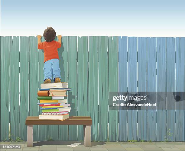 schoolboy on pile of books looking over fence - curiosity stock illustrations