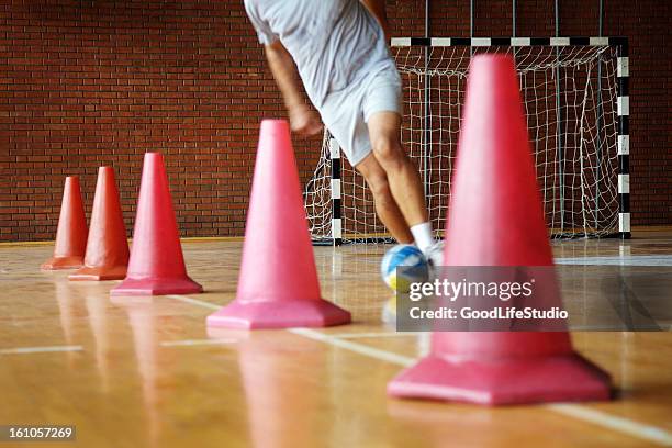 dribbling - indoor soccer stock pictures, royalty-free photos & images
