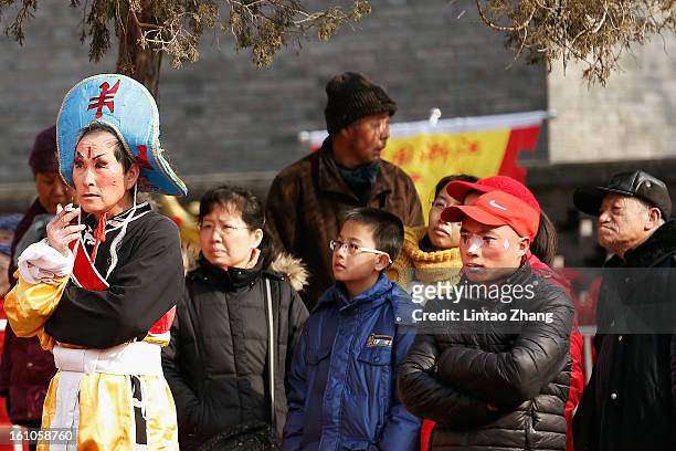 Chinese folk artists prepare to perform during the opening ceremony of the Spring Festival Temple Fair at Dragon Lake Park on February 9, 2013 in...