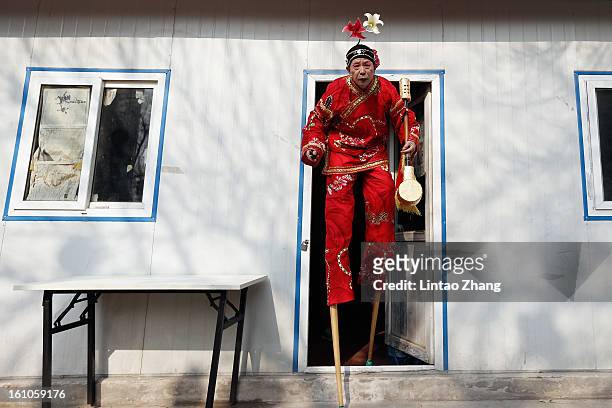 Chinese folk artists prepare to perform during the opening ceremony of the Spring Festival Temple Fair at Dragon Lake Park on February 9, 2013 in...