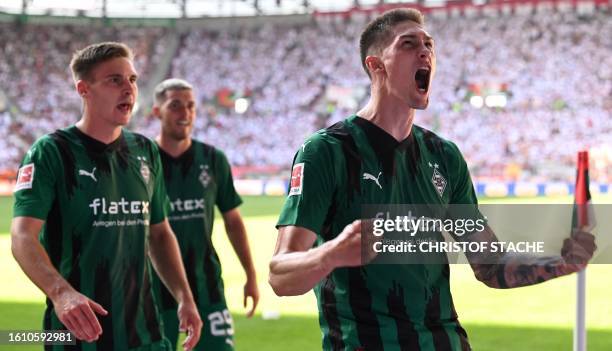 Moenchengladbach's Czech forward Tomas Cvancara celebrates after scoring a penalty during German first division Bundesliga football match between FC...